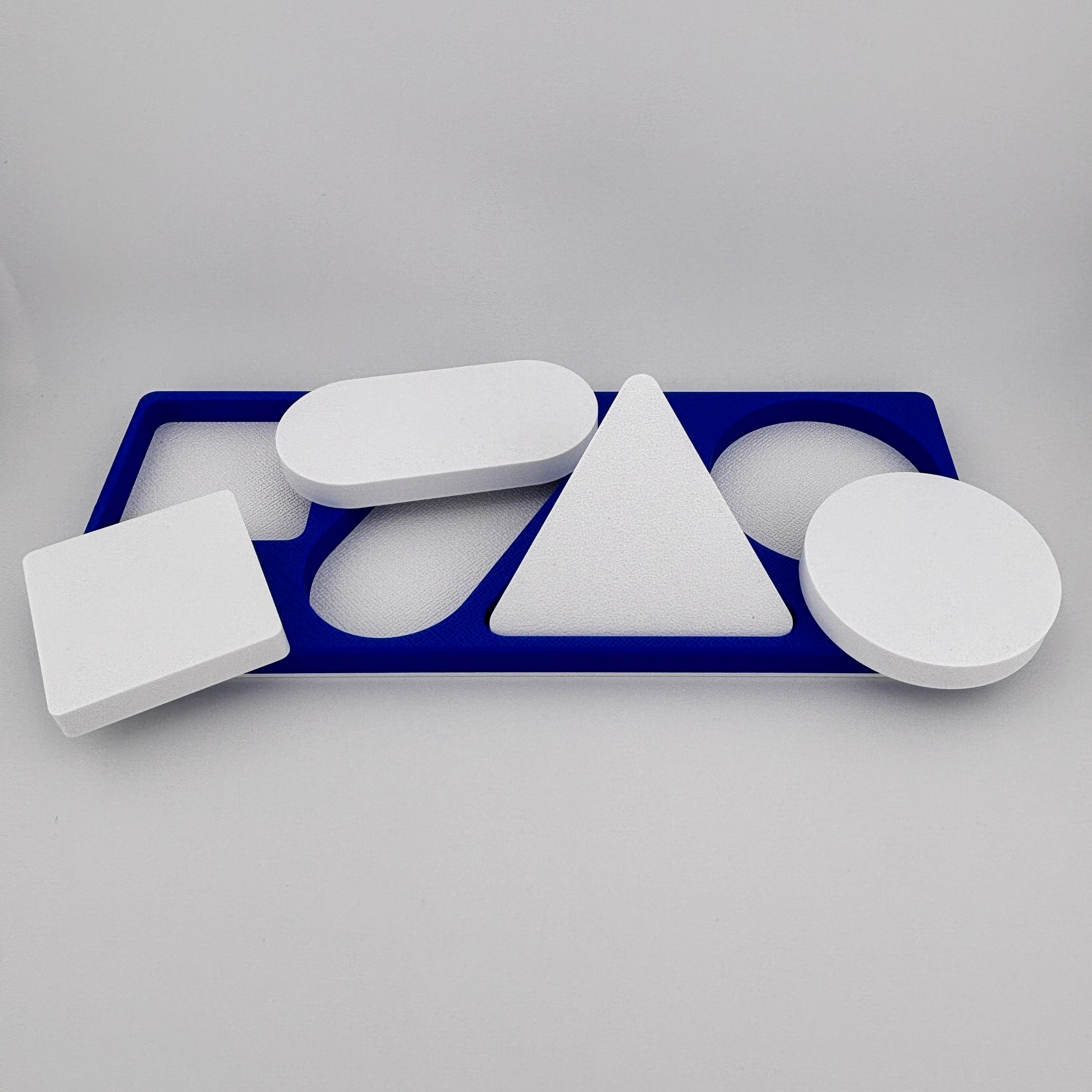 Las 4 piezas blancas Merrill-Palmer-R cuadrado ovalo triangulo y circulo PLA precisión evaluación infantil | Merrill-Palmer-R 4 white pieces square oval triangle circle PLA precisión child developmental assessment