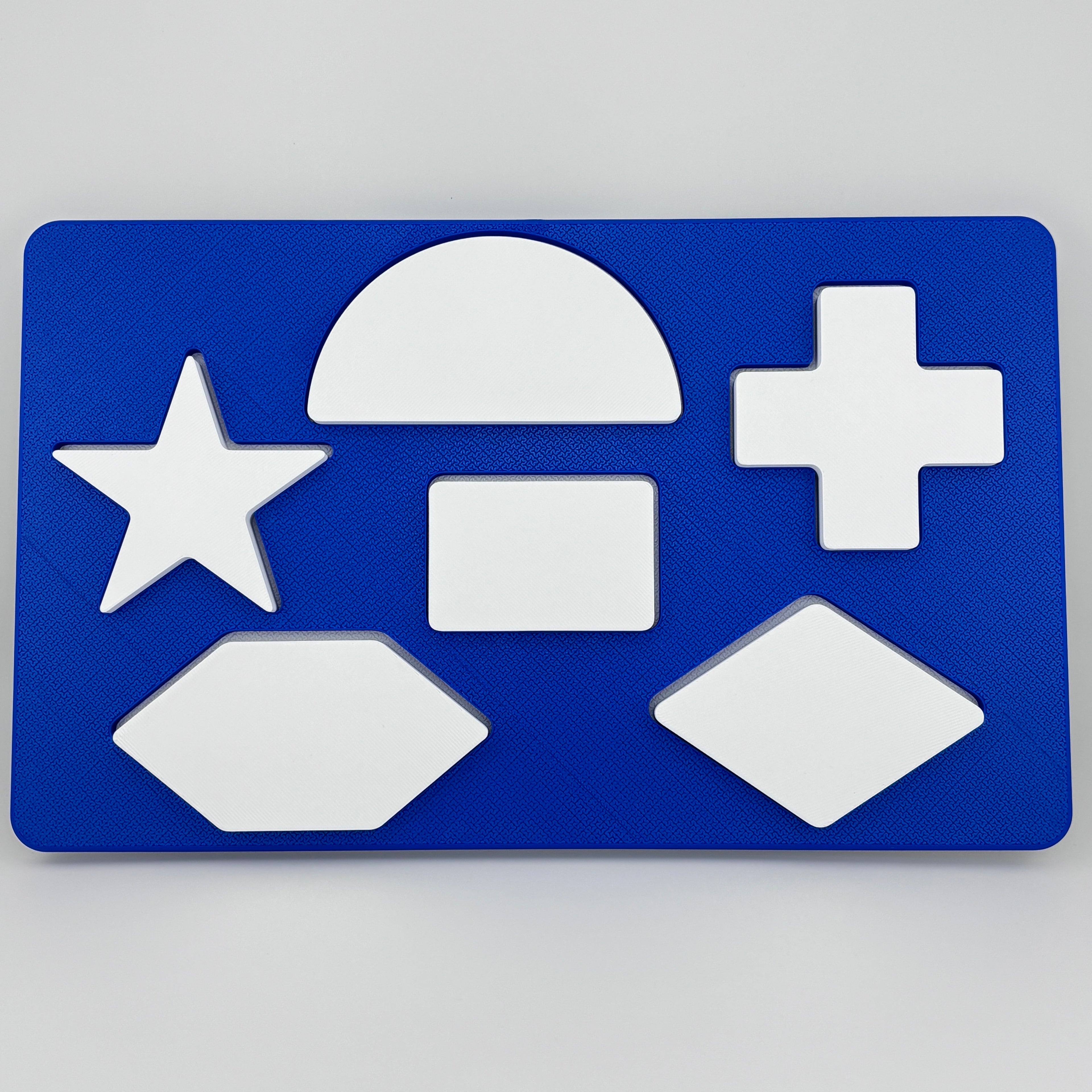 Tablero Merrill-Palmer-R azul 6 piezas blancas encajadas evaluación desarrollo cognitivo infantil PLA | Merrill-Palmer-R blue form board 6 white pieces fitted cognitive developmental PLA assessment children