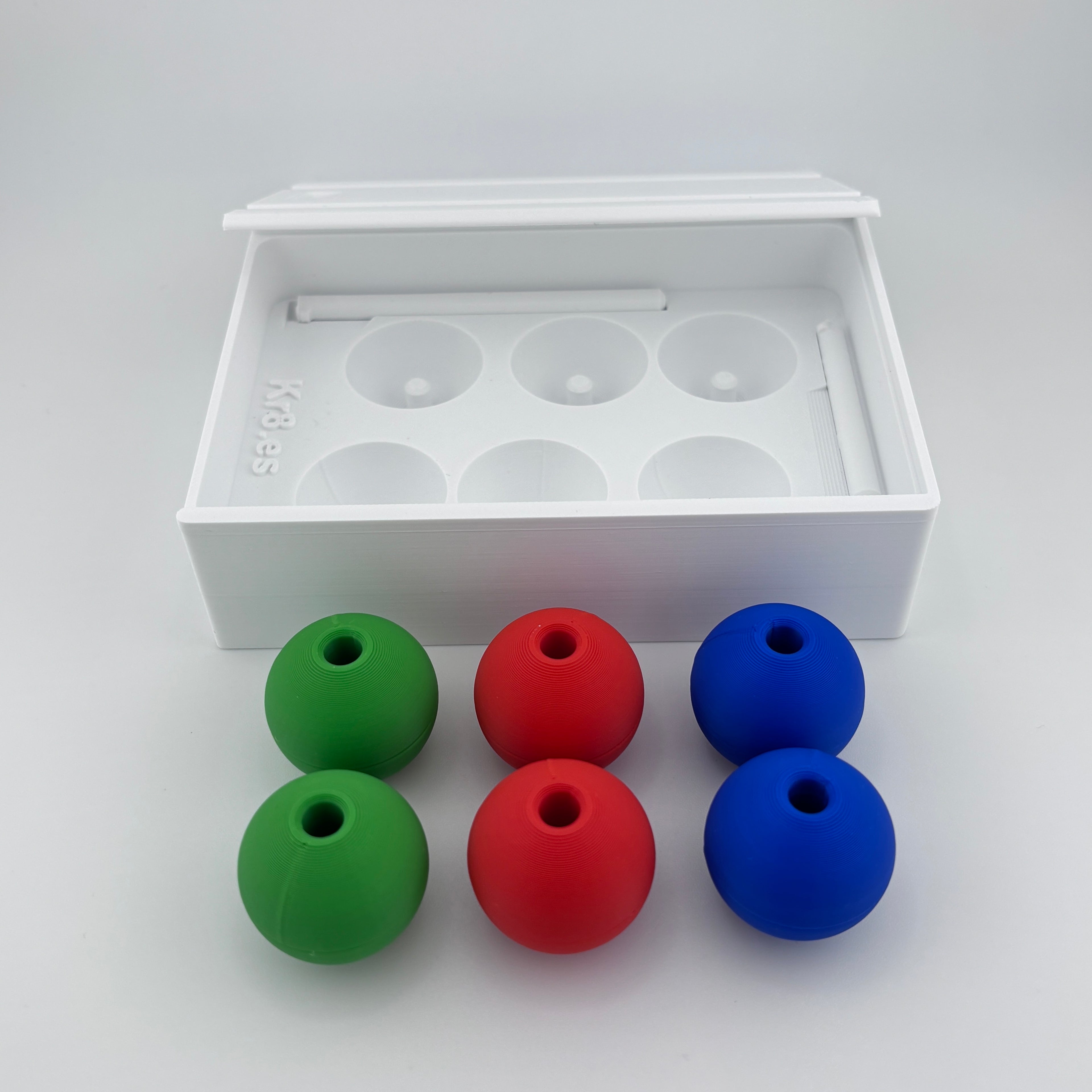 Caja transporte Torre de Londres abierta con esferas y varillas organizadas. Tower of London travel case open organized balls pegs neuropsychological clinical